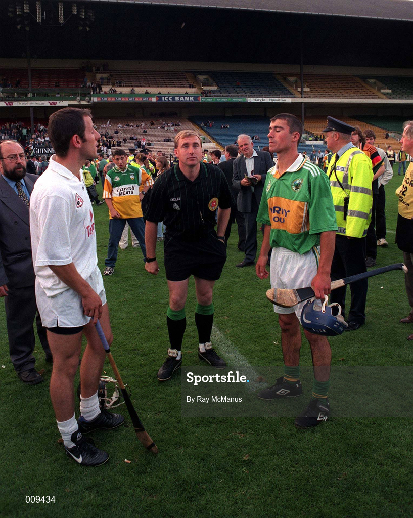 22 August 1998; Referee Michael Wadding performs the pre-match coin toss with team captains Tony Spain of Kildare and Conor Flaherty of Kerry before the All Ireland Under-21 'B' hurling Final between Kerry and Kildare at Croke Park in Dublin. The game was postponed due to a protest on the pitch by Offaly supporters due to the amount of time played in their Guinness All-Ireland Senior Hurling Championship Semi-Final defeat to Clare in the previous game. Photo by Ray McManus/Sportsfile