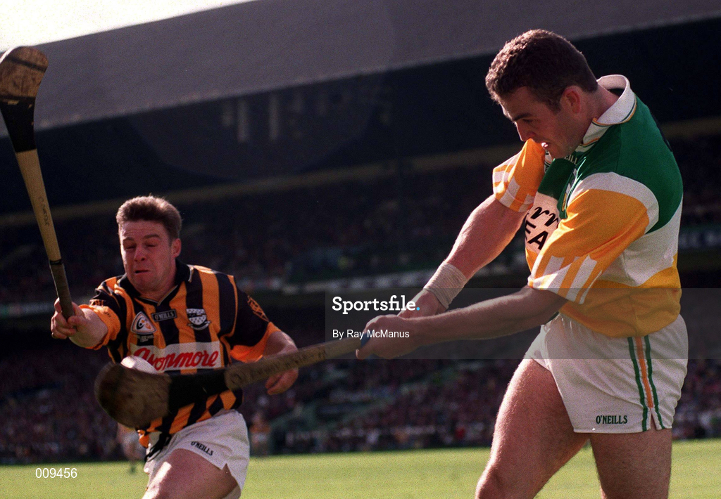 13 September 1998; Kevin Martin of Offaly clears downfield despite the blockdown attempt by Kilkenny's Charlie Carter of Kilkenny during the Guinness All-Ireland Senior Hurling Championship Final match between Kilkenny and Offaly at Croke Park in Dublin. Photo by Ray McManus/Sportsfile