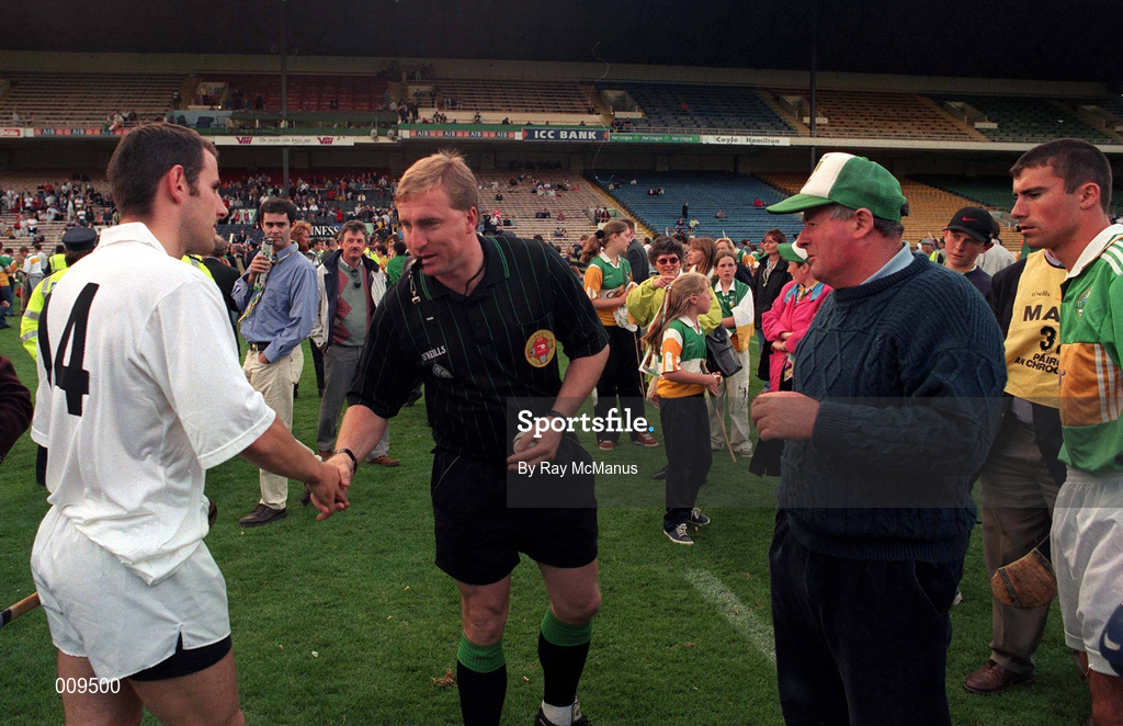 22 August 1998; Referee Michael Wadding with team captains Tony Spain of Kildare and Conor Flaherty of Kerry before the All Ireland Under-21 'B' hurling Final match between Kerry and Kildare at Croke Park in Dublin. The game was postponed due to a protest on the pitch by Offaly supporters due to the amount of time played in their Guinness All-Ireland Senior Hurling Championship Semi-Final defeat to Clare in the previous game. Photo by Ray McManus/Sportsfile