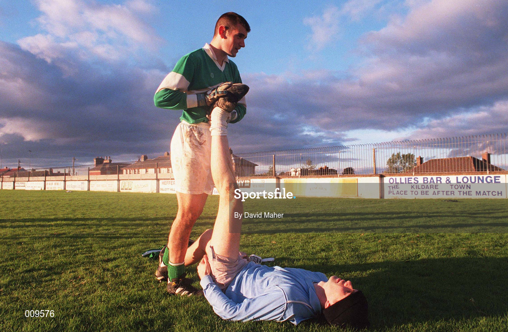 15 September 1998; Kildare goalkeeper Christy Byrne helps team-mate Martin Lynch with his stretches during a Kildare senior football squad training session at St Conleth's Park in Newbridge, Kildare. Photo by David Maher/Sportsfile