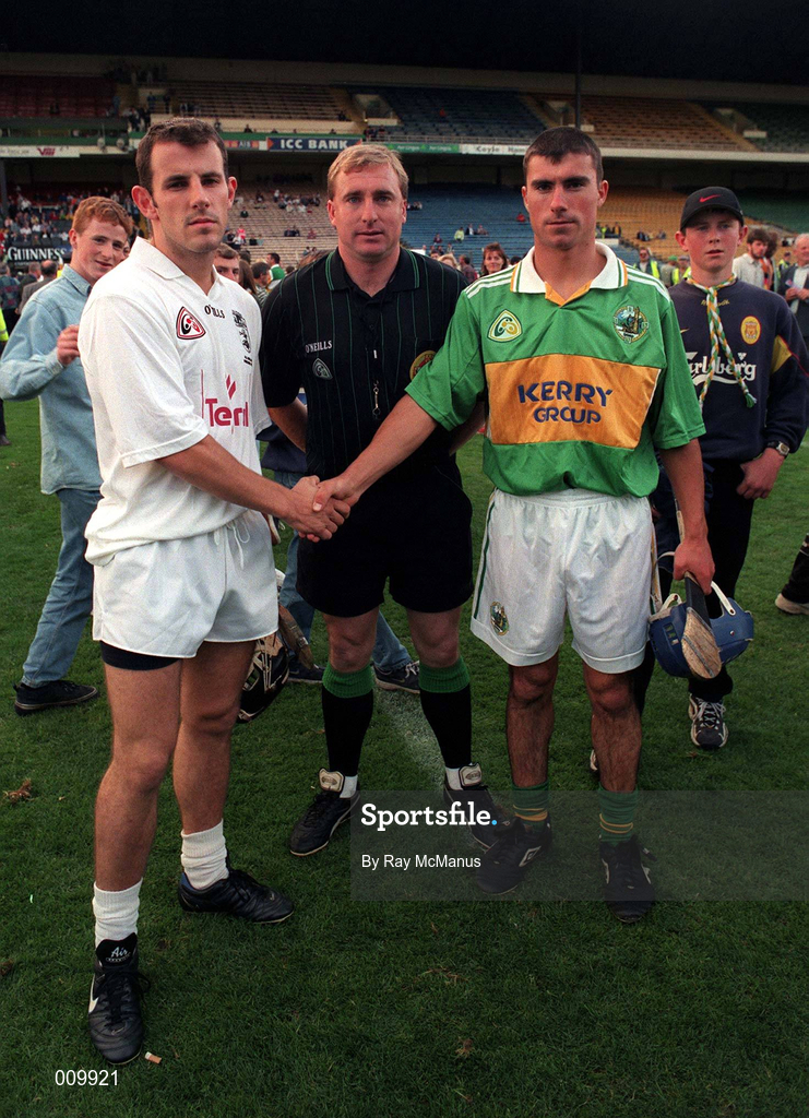 22 August 1998; Referee Michael Wadding with team captains Tony Spain of Kildare and Conor Flaherty of Kerry before the All Ireland Under-21 'B' hurling Final match between Kerry and Kildare at Croke Park in Dublin. The game was postponed due to a protest on the pitch by Offaly supporters due to the amount of time played in their Guinness All-Ireland Senior Hurling Championship Semi-Final defeat to Clare in the previous game. Photo by Ray McManus/Sportsfile