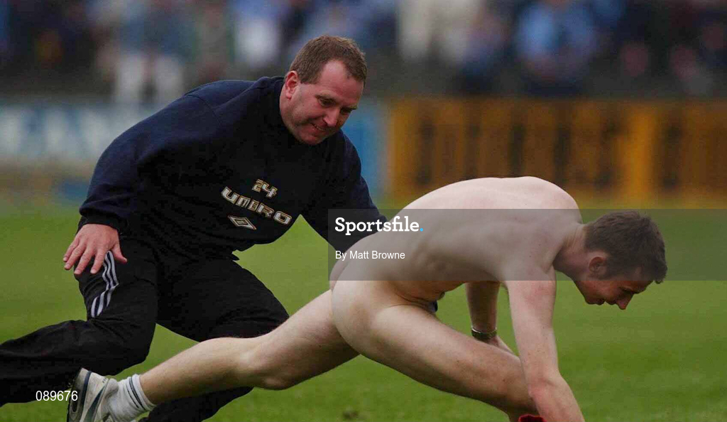 1 June 2002; A match official tries to apprehend a streaker during the Bank of Ireland Leinster Senior Football Championship Quarter-Final match between Wexford and Dublin at Dr. Cullen Park in Carlow. Photo by Matt Browne/Sportsfile