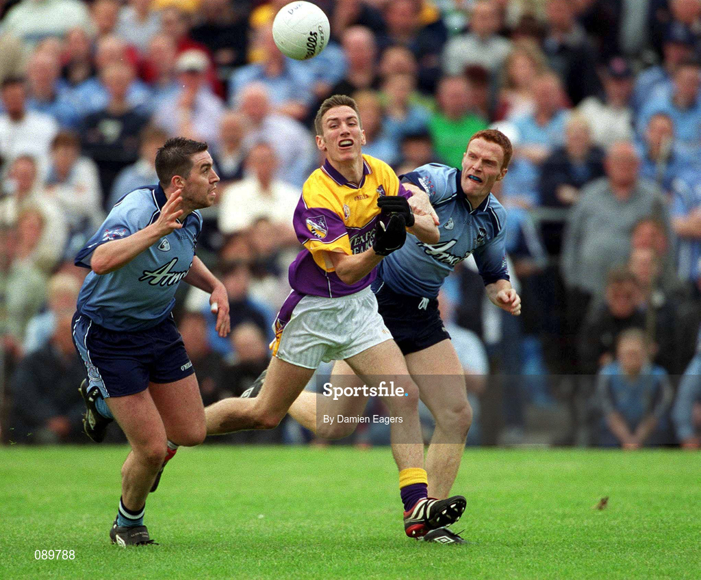 1 June 2002; Redmond Barry of Wexford in action against Jonathan Magee, left, and Peadar Andrews of Dublin during the Bank of Ireland Leinster Senior Football Championship Quarter-Final match between Wexford and Dublin at Dr. Cullen Park in Carlow. Photo by Damien Eagers/Sportsfile