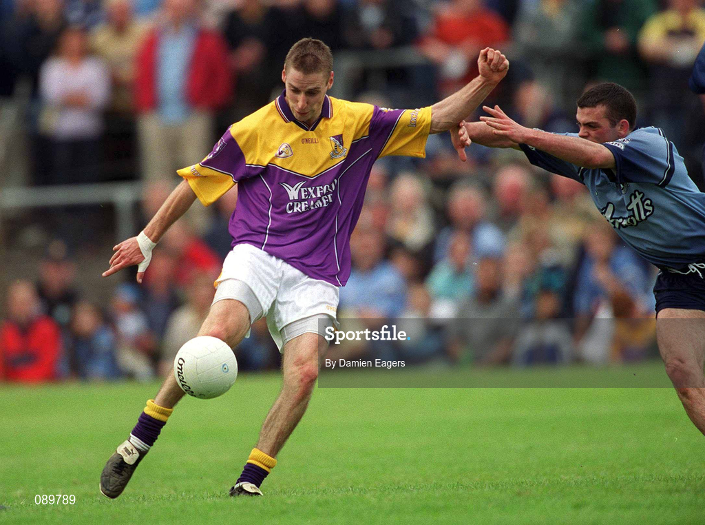 1 June 2002; Matty Forde of Wexford in action against Paul Casey of Dublin during the Bank of Ireland Leinster Senior Football Championship Quarter-Final match between Wexford and Dublin at Dr. Cullen Park in Carlow. Photo by Damien Eagers/Sportsfile