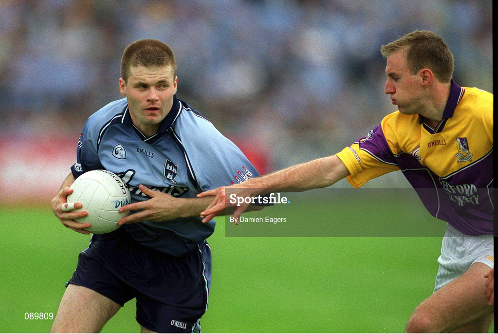 1 June 2002; Dessie Farrell of Dublin in action against Philip Wallace of Wexford during the Bank of Ireland Leinster Senior Football Championship Quarter-Final match between Wexford and Dublin at Dr. Cullen Park in Carlow. Photo by Damien Eagers/Sportsfile