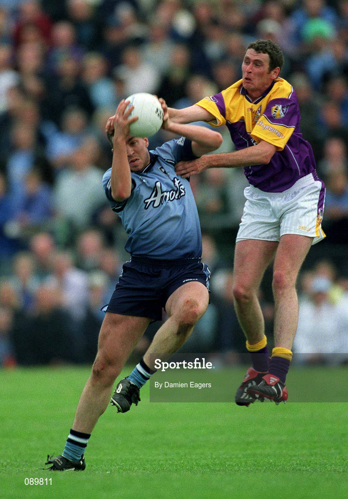 1 June 2002; Jonathan Magee of Dublin in action against Jack Berry of Wexford during the Bank of Ireland Leinster Senior Football Championship Quarter-Final match between Wexford and Dublin at Dr. Cullen Park in Carlow. Photo by Damien Eagers/Sportsfile