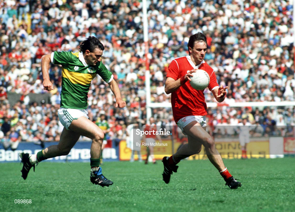1 July 1990; Cork's Danny Culloty races clear of Kerry's Morgan Nix during the Munster Senior Football Championship Final match between Cork and Kerry at Pairc Ui Chaoimh in Cork. Photo by Ray McManus/Sportsfile