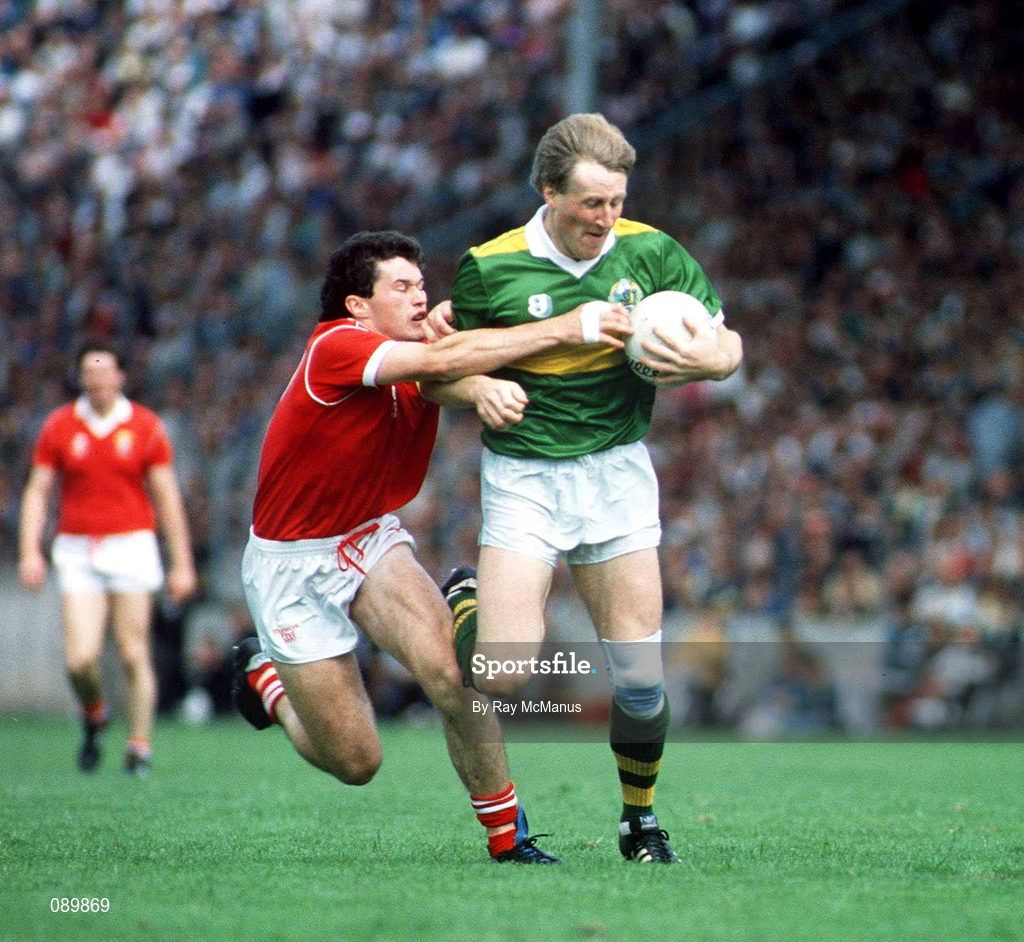 1 July 1990; Kerry's Pat Spillane is tackled by Cork's Denis Walsh during the Munster Senior Football Championship Final match between Cork and Kerry at Pairc Ui Chaoimh in Cork. Photo by Ray McManus/Sportsfile