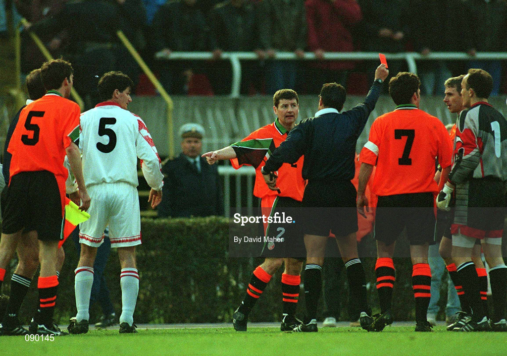 2 April 1997; Denis Irwin of Republic of Ireland remonstrate with referee Alfredo Trentalange as he shows a red card to Jason McAteer during the FIFA World Cup 1998 Group 8 Qualifier match between FYR Macedonia and Republic of Ireland at the City Stadium in Skopje, FYR Macedonia. Photo by David Maher/Sportsfile