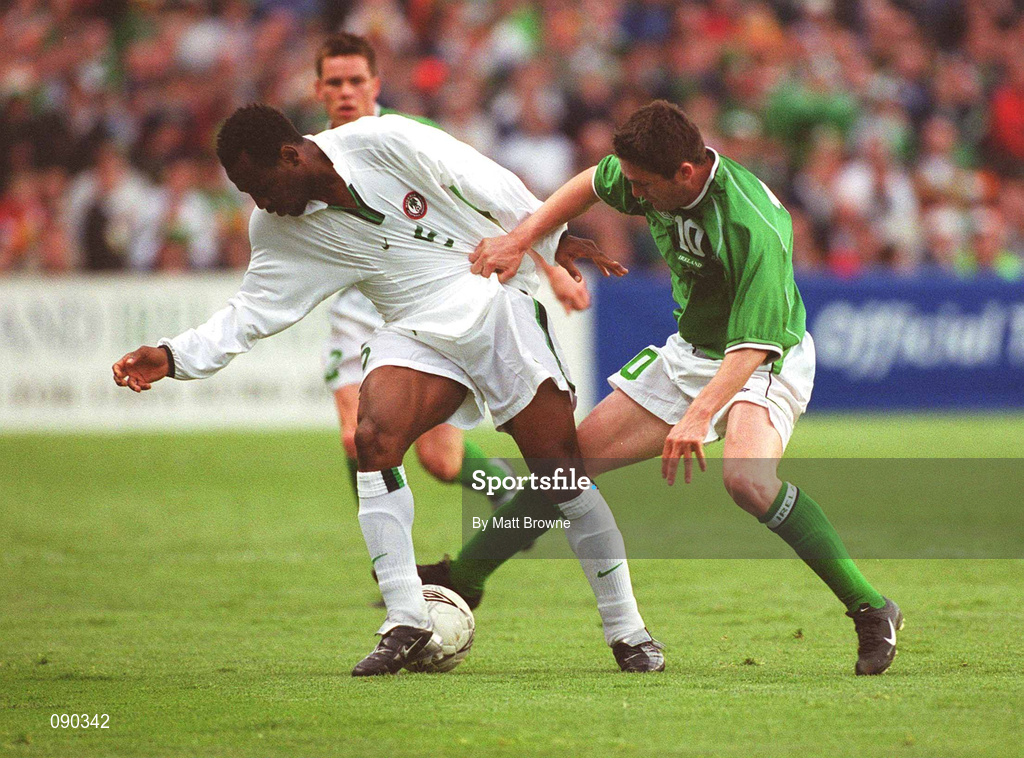 16 May 2002; Isaac Okoronkwo of Nigeria is tackled by Republic of Ireland's Robbie keane during the International Friendly match between Republic of Ireland and Nigeria at Lansdowne Road in Dublin. Photo by Matt Browne/Sportsfile