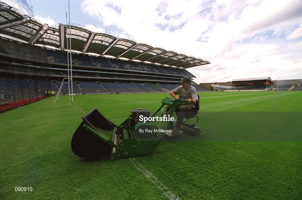12 June 2002; Groundsman Fergus Finneran cuts the newly laid pitch at Croke Park in Dublin. Photo by Ray McManus/Sportsfile