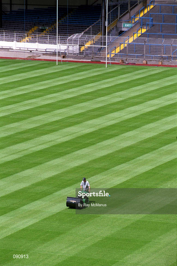 12 June 2002; Groundsman Fergus Finneran cuts the newly laid pitch at Croke Park in Dublin. Photo by Ray McManus/Sportsfile