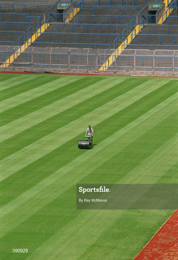 12 June 2002; Groundsman Fergus Finneran cuts the newly laid pitch at Croke Park in Dublin. Photo by Ray McManus/Sportsfile