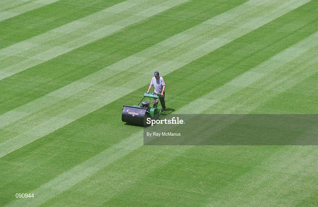 12 June 2002; Groundsman Fergus Finneran cuts the newly laid pitch at Croke Park in Dublin. Photo by Ray McManus/Sportsfile