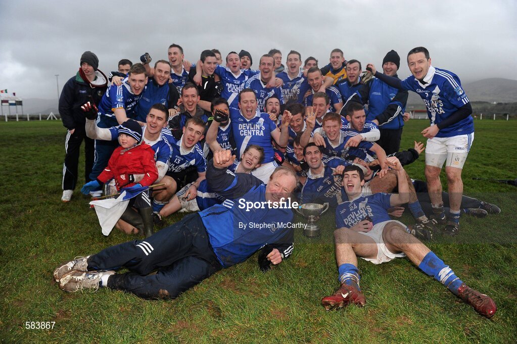 24 December 2011; St. Mary's players and management celebrate with the Jack Murphy Cup. South Kerry Senior Football Championship Final, St. Mary's v Dromid Pearses, Waterville Sportsfield, Waterville, Co. Kerry. Picture credit: Stephen McCarthy / SPORTSFILE
