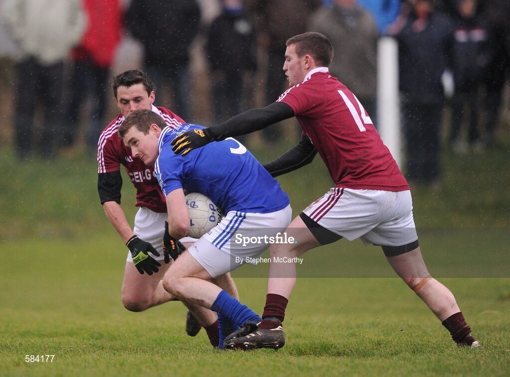 24 December 2011; Brian Curran, St. Mary's, in action against Thomas Curran, left, and Niall O Se, Dromid Pearses. South Kerry Senior Football Championship Final, St. Mary's v Dromid Pearses, Waterville Sportsfield, Waterville, Co. Kerry. Picture credit: Stephen McCarthy / SPORTSFILE