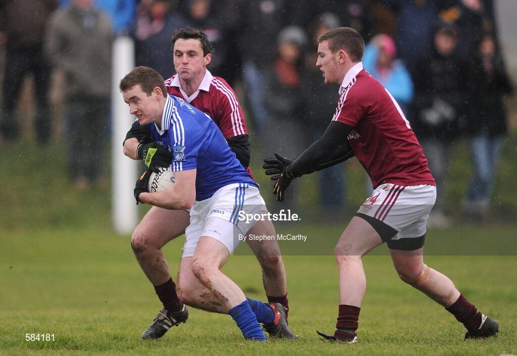 24 December 2011; Brian Curran, St. Mary's, in action against Thomas Curran, left, and Niall O Se, Dromid Pearses. South Kerry Senior Football Championship Final, St. Mary's v Dromid Pearses, Waterville Sportsfield, Waterville, Co. Kerry. Picture credit: Stephen McCarthy / SPORTSFILE