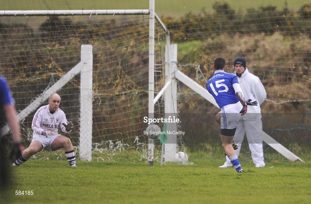 24 December 2011; Daniel Daly, St. Mary's, shoots past Dromid Pearses goalkeeper Alan Hogan to score his side's first goal. South Kerry Senior Football Championship Final, St. Mary's v Dromid Pearses, Waterville Sportsfield, Waterville, Co. Kerry. Picture credit: Stephen McCarthy / SPORTSFILE