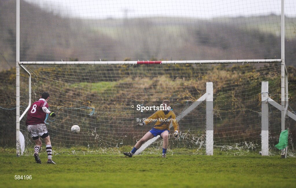 24 December 2011; Thomas Curran, Dromid Pearses, shoots past St. Mary's goalkeeper Damien Horgan for his side's goal from a penalty. South Kerry Senior Football Championship Final, St. Mary's v Dromid Pearses, Waterville Sportsfield, Waterville, Co. Kerry. Picture credit: Stephen McCarthy / SPORTSFILE