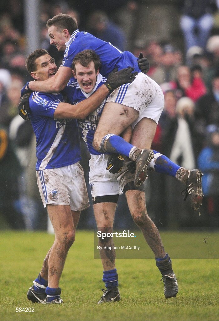24 December 2011; St. Mary's players, from left, Maurice Fitzgerald, Niall O'Driscoll and Paul O'Donoghue, on top, celebrate their side's victory. South Kerry Senior Football Championship Final, St. Mary's v Dromid Pearses, Waterville Sportsfield, Waterville, Co. Kerry. Picture credit: Stephen McCarthy / SPORTSFILE