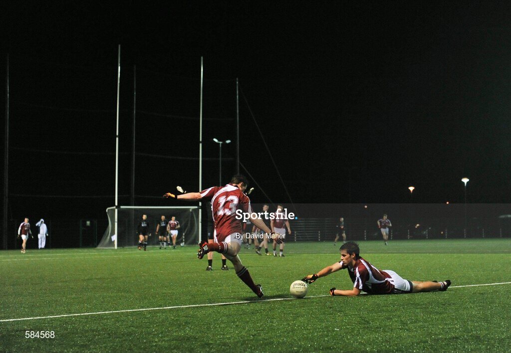 4 January 2012; Stephen Guing, NUIG, keeps the ball steady in the windy conditions as his team-mate Neil Douglas takes a free kick during the game. FBD Insurance League, Section A, Round 1, Sligo v NUIG, Connacht GAA Centre of Excellence, Ballyhaunis, Co. Mayo. Picture credit: David Maher / SPORTSFILE