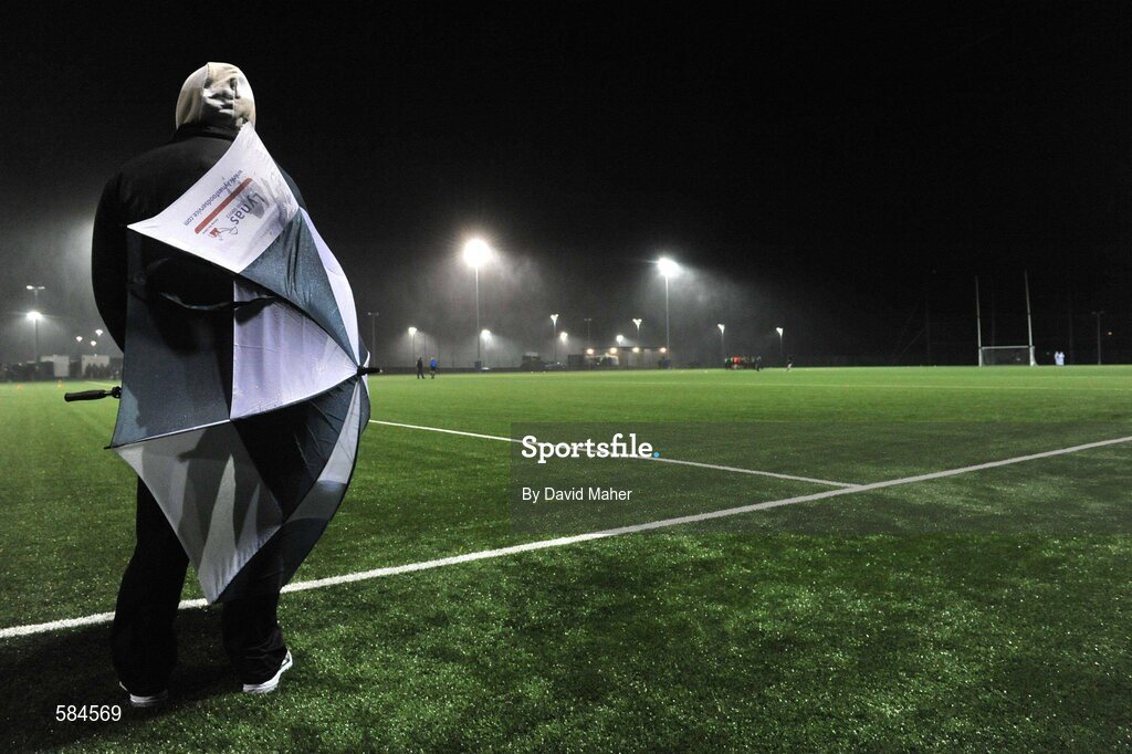 4 January 2012; A general view of a spectator holdin up an umbrella during heavy wind and rain before the game. FBD Insurance League, Section A, Round 1, Sligo v NUIG, Connacht GAA Centre of Excellence, Ballyhaunis, Co. Mayo. Picture credit: David Maher / SPORTSFILE