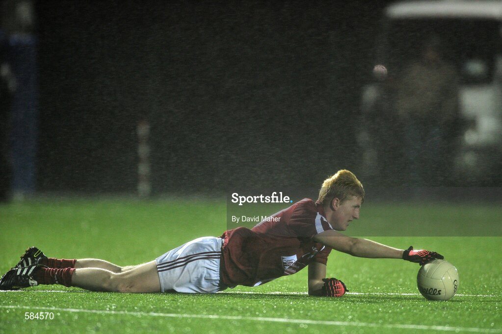 4 January 2012; Conor Walsh, NUIG, keeps the ball steady in the windy conditions for his team-mate to kick a free during the game. FBD Insurance League, Section A, Round 1, Sligo v NUIG, Connacht GAA Centre of Excellence, Ballyhaunis, Co. Mayo. Picture credit: David Maher / SPORTSFILE