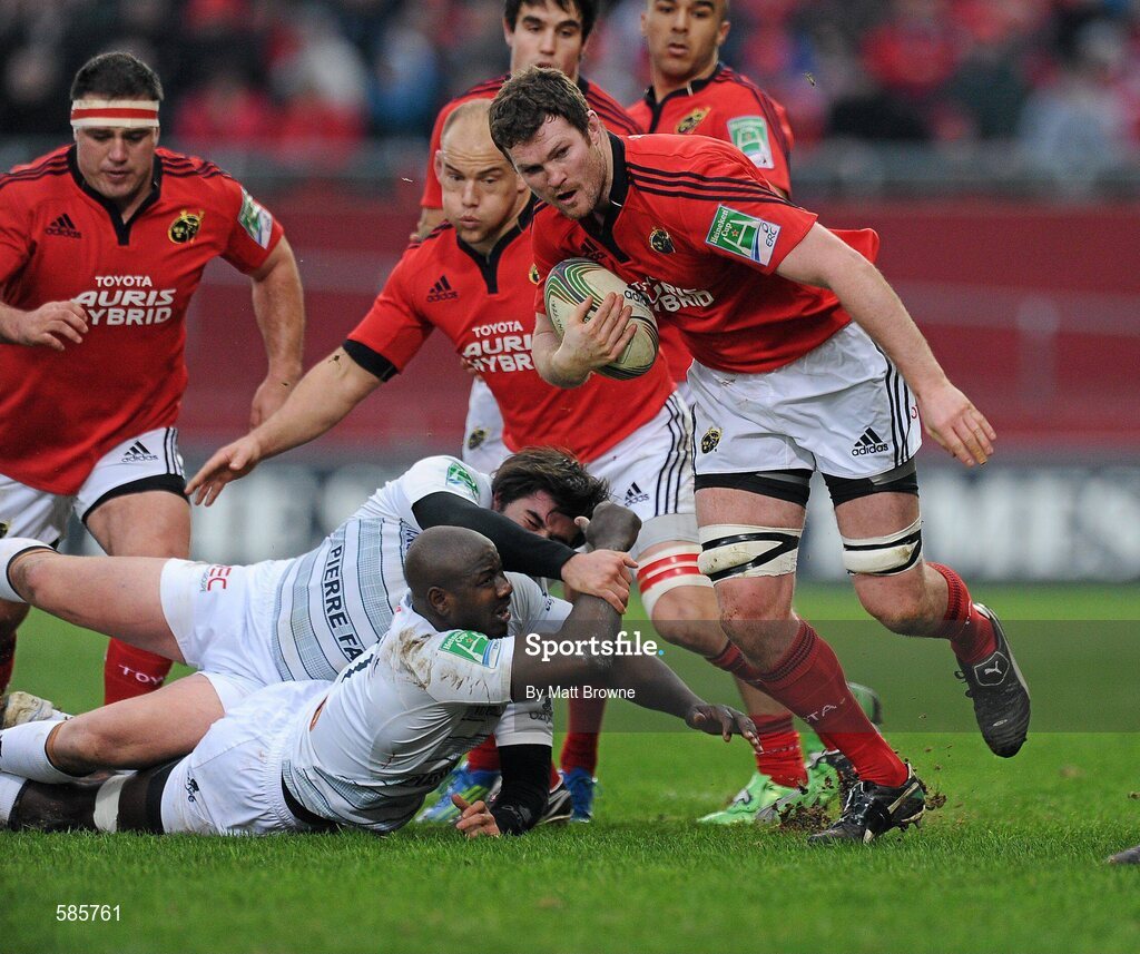 14 January 2012; Donnacha Ryan, Munster, is tackled by Marc-Antoine Rallier and Ibrahim Diarra, Castres Olympique. Heineken Cup, Pool 1, Round 5, Munster v Castres Olympique, Thomond Park, Limerick. Picture credit: Matt Browne / SPORTSFILE
