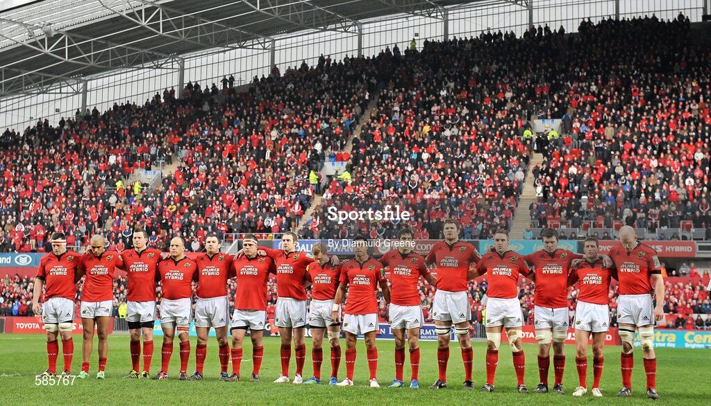 14 January 2012; Munster players stand together during a minute's silence in memory of former Munster and Ireland player Colm Tucker. Heineken Cup, Pool 1, Round 5, Munster v Castres Olympique, Thomond Park, Limerick. Picture credit: Diarmuid Greene / SPORTSFILE