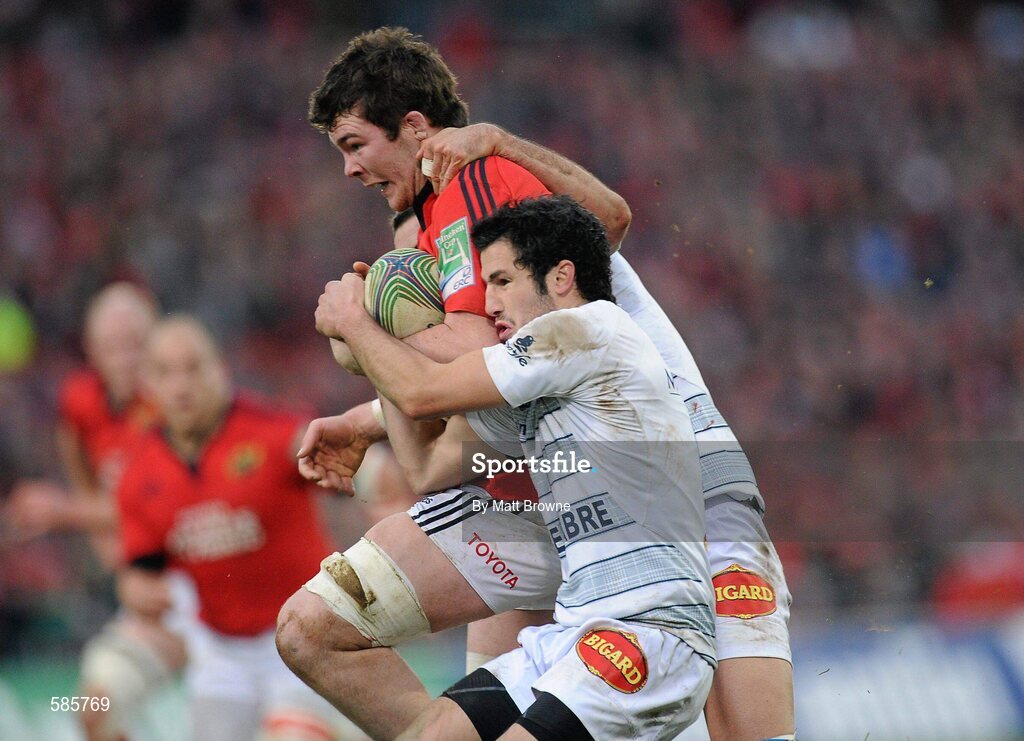 14 January 2012; Peter O'Mahony, Munster, is tackled by Vincent Inigo and Yannick Caballero, Castres Olympique. Heineken Cup, Pool 1, Round 5, Munster v Castres Olympique, Thomond Park, Limerick. Picture credit: Matt Browne / SPORTSFILE