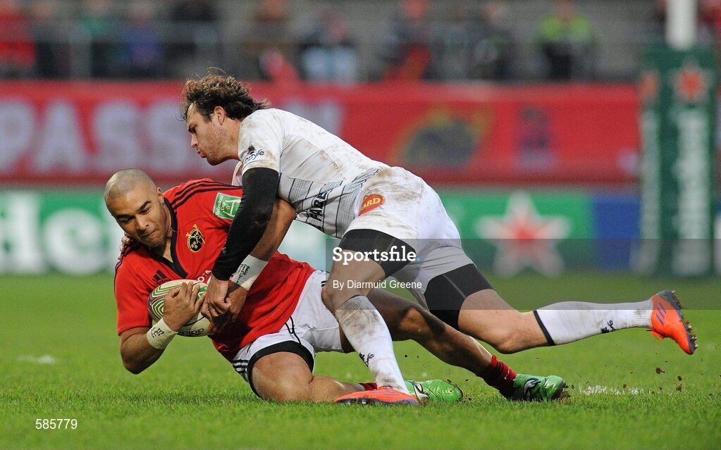 14 January 2012; Simon Zebo, Munster, is tackled by Paul Bonnefond, Castres Olympique. Heineken Cup, Pool 1, Round 5, Munster v Castres Olympique, Thomond Park, Limerick. Picture credit: Diarmuid Greene / SPORTSFILE