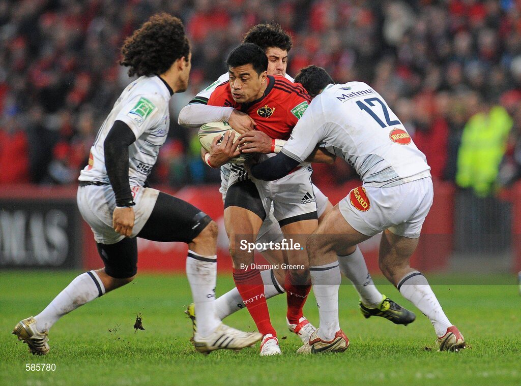 14 January 2012; Lifeimi Mafi, Munster, is tackled by Pierre-Gilles Lakafia, left, Pierre Bernard and Pierre-Manuel Garcia, right, Castres Olympique. Heineken Cup, Pool 1, Round 5, Munster v Castres Olympique, Thomond Park, Limerick. Picture credit: Diarmuid Greene / SPORTSFILE