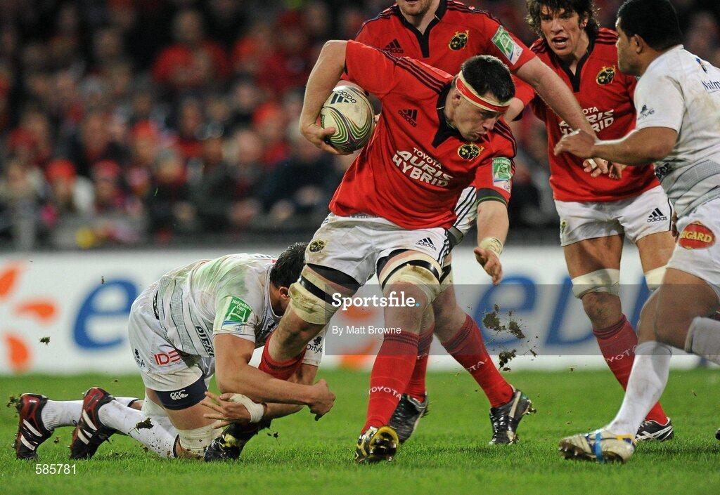 14 January 2012; James Coughlan, Munster, is tackled by Matthias Rolland, Castres Olympique. Heineken Cup, Pool 1, Round 5, Munster v Castres Olympique, Thomond Park, Limerick. Picture credit: Matt Browne / SPORTSFILE
