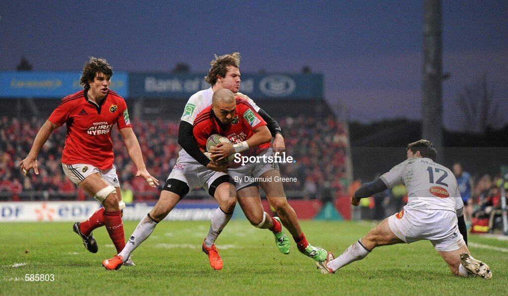 14 January 2012; Simon Zebo, supported by Donncha O'Callaghan, Munster, is tackled by Paul Bonnefond, Castres Olympique. Heineken Cup, Pool 1, Round 5, Munster v Castres Olympique, Thomond Park, Limerick. Picture credit: Diarmuid Greene / SPORTSFILE