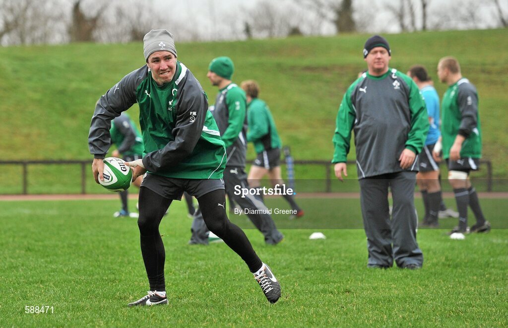 24 January 2012; Ireland's Paddy Wallace, watched by head coach Declan Kidney, in action during squad training ahead of their RBS Six Nations Rugby Championship game against Wales on February 5th. Ireland Rugby Squad Training, University of Limerick, Limerick. Picture credit: Diarmuid Greene / SPORTSFILE