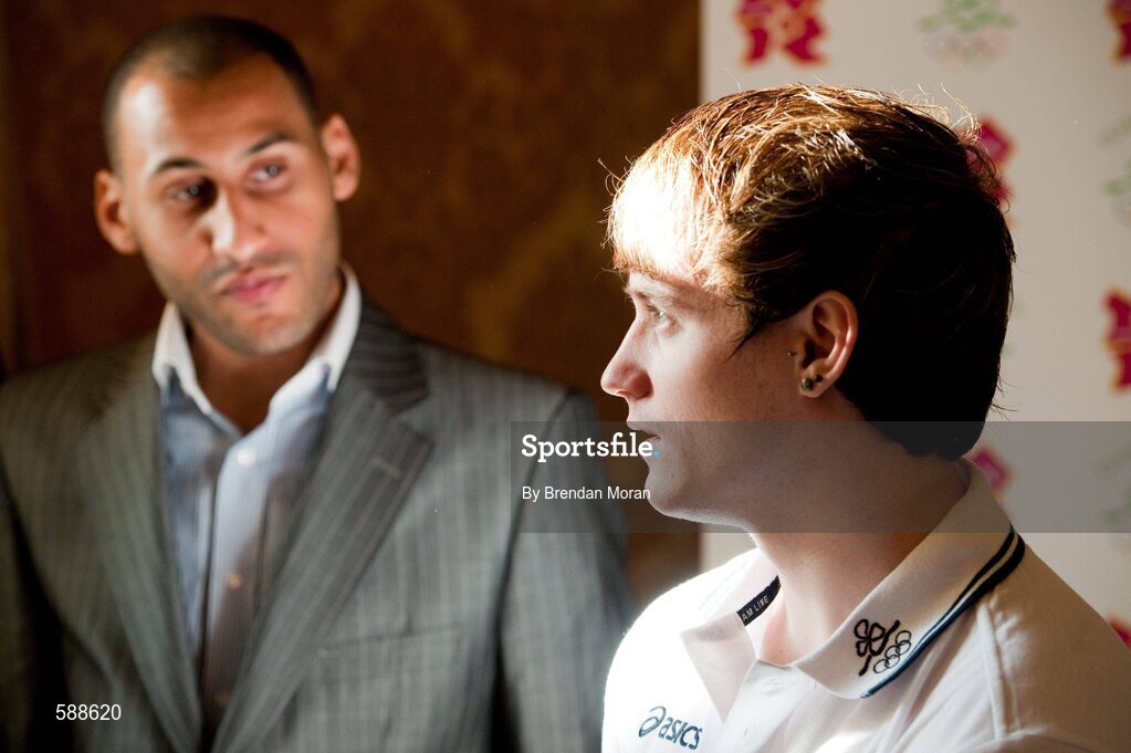 25 January 2012; Ireland's latest Olympic team member, gymnast Kieran Behan, who was presented with a cheque for €20,000 by the Olympic Council of Ireland to assist his preparations for the London Olympic Games later this year. Kieran's coach Demetrios Bradshaw looks on as he talks to members of the media. The 22 year old, who was told he would never walk again after a childhood illness, has overcome enormous obstacles to be the first Irish gymnast to qualify for the games since 1996. Shelbourne Hotel, Dublin. Picture credit: Brendan Moran / SPORTSFILE