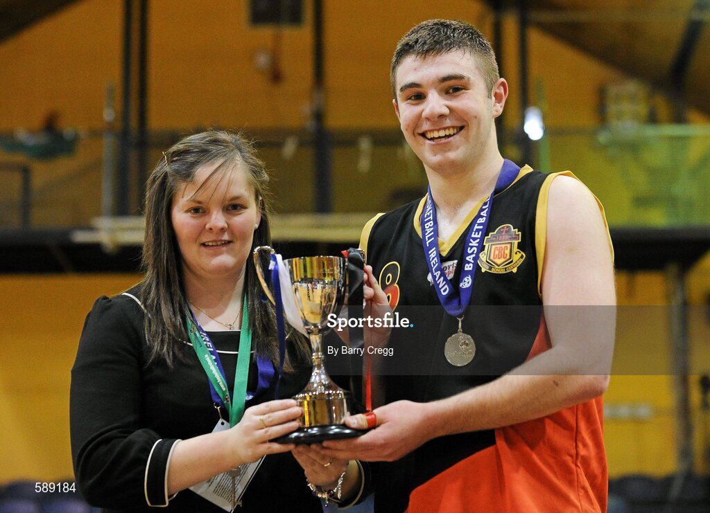 27 January 2012; Receiving the winning trophy from Competitions Officer of Basketball Ireland Louise O'Loughlin is Christian Brothers College captain Dylan Lenihan. All-Ireland Schools Cup U16B Boys Final, Christian Brothers College, Cork v St. Clement's, Limerick, National Basketball Arena, Tallaght, Dublin. Picture credit: Barry Cregg / SPORTSFILE
