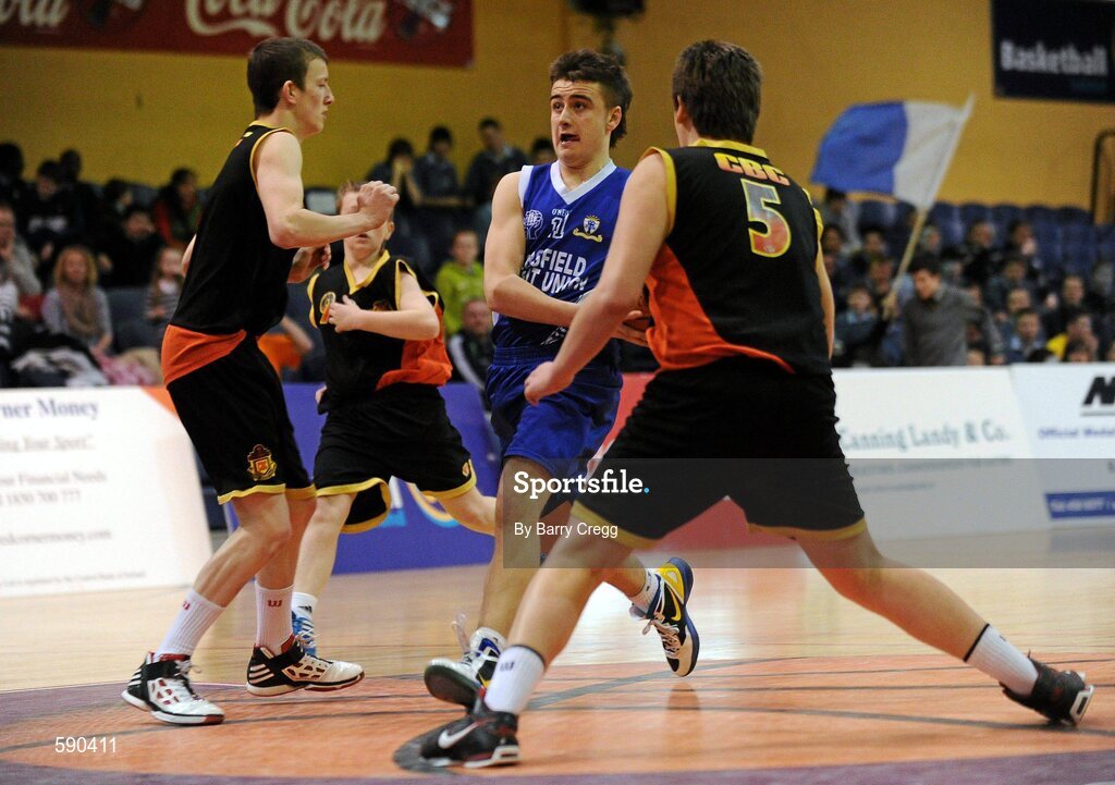 27 January 2012; Jamie Marshall, St. Clement's, Limerick, in action against Jamie Beadle, left, and Eoin Barrett, right, Christian Brothers College, Cork. All-Ireland Schools Cup U16B Boys Final, Christian Brothers College, Cork v St. Clement's, Limerick, National Basketball Arena, Tallaght, Dublin. Picture credit: Barry Cregg / SPORTSFILE