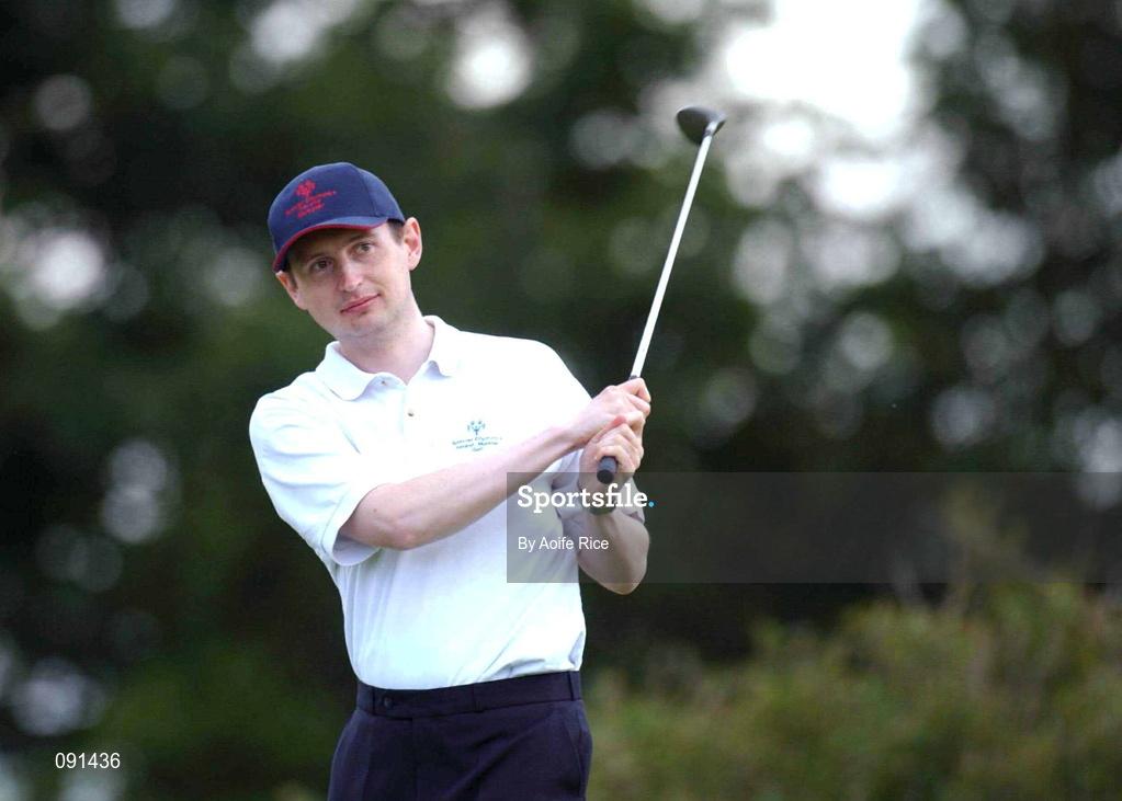 20 June 2002; Kevin McCloskey watches his shot from the first tee box during the 2002 Special Olympics Ireland National Games at Elm Green Golf Club in Castleknock, Dublin. Photo by Aoife Rice/Sportsfile