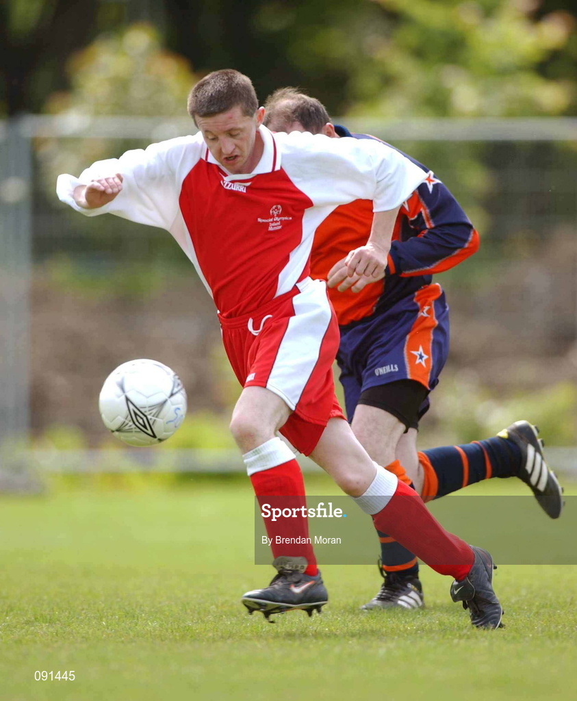 20 June 2002; Padraig O'Lone of Munster A in action against Declan Clifford of Leinster A during their 2002 Special Olympics Ireland National Games 11-a-side soccer match at the UCD Bowl in Dublin. Photo by Brendan Moran/Sportsfile