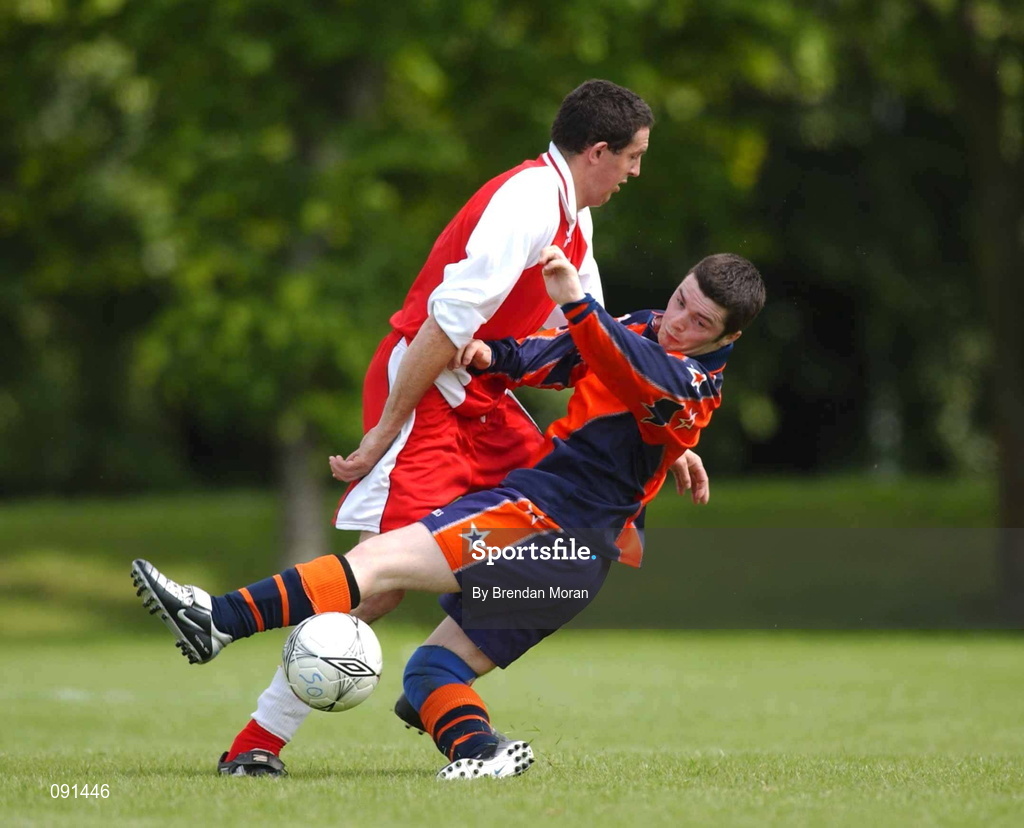 20 June 2002; Adrian Maher of Leinster A is tackled by Michael Daly of Munster A during their 2002 Special Olympics Ireland National Games 11-a-side soccer match at the UCD Bowl in Dublin. Photo by Brendan Moran/Sportsfile