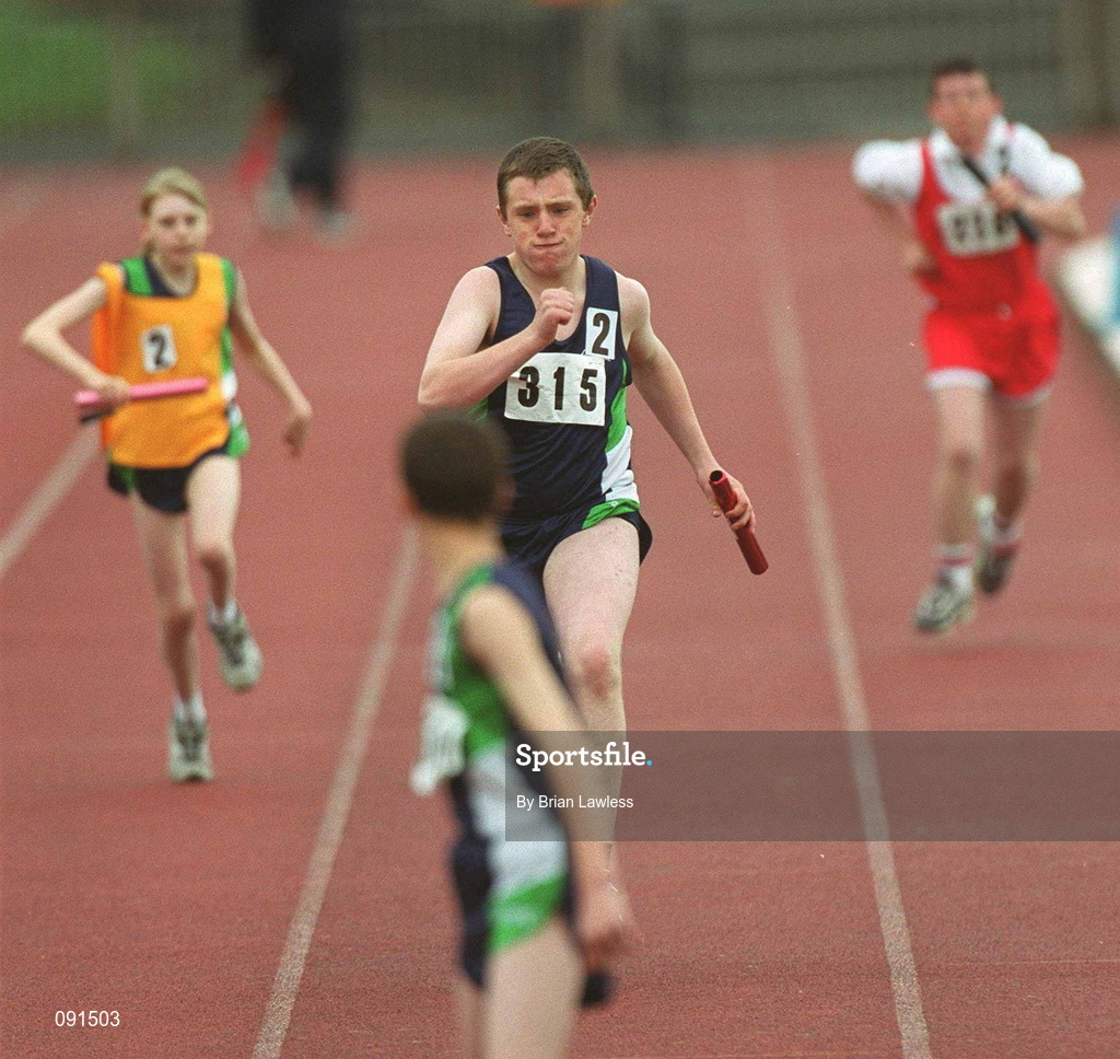 21 June 2002; Special Olympics athlete Robert Adams, 315, from Antrim, races towards his Ulster team-mate Jeffrey Graham with the baton during the 4x100m relay race during the 2002 Special Olympics Ireland National Games at Morton Stadium in Santry, Dublin. Photo by Brian Lawless/Sportsfile