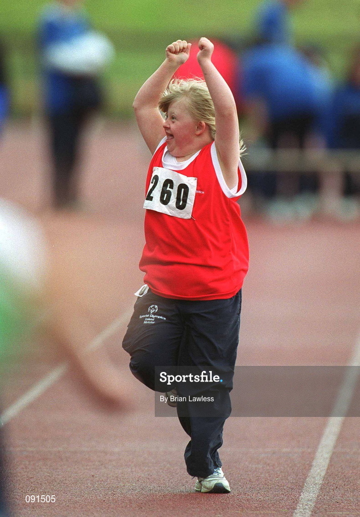 21 June 2002; Special Olympics athlete Terri Gray, age 9, from Tipperary, waves to the crowd as she crosses the finish line during a 50m Run during the 2002 Special Olympics Ireland National Games at Morton Stadium in Santry, Dublin. Photo by Brian Lawless/Sportsfile