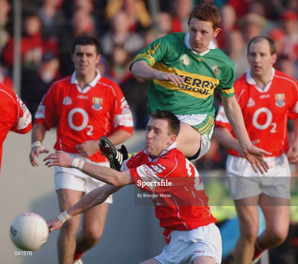 23 June 2002; Kerry's Noel Kennelly has a shot blocked by Cork's Jim O'Donoghue during the Bank of Ireland Munster Senior Football Championship Semi-Final Replay match between Cork and Kerry at Páirc U’ Chaoimh in Cork. Photo by Brendan Moran/Sportsfile
