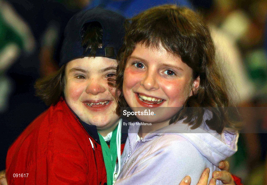 23 June 2002; Special Olympian Aoife O'Sullivan and her sister Ciara, from Cork city, during the 2002 Special Olympics Ireland National Games closing ceremony at the RDS in Dublin. Photo by Ray McManus/Sportsfile
