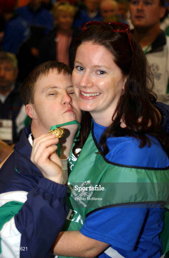 23 June 2002; Special Olympian Grant Wilson embraces Volunteer Siobhan Hennessy during the 2002 Special Olympics Ireland National Games closing ceremony at the RDS in Dublin. Photo by Ray McManus/Sportsfile