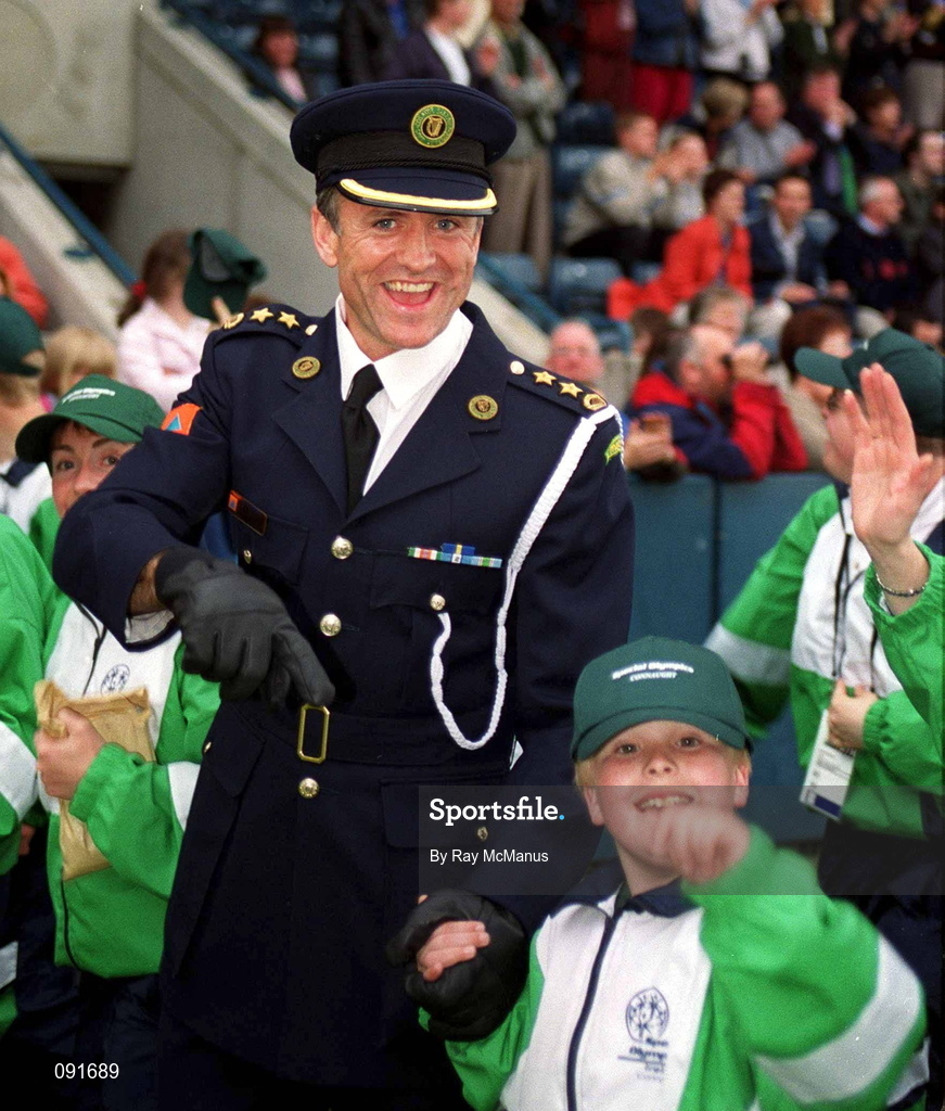 19 June 2002; Special Olympian Brian Doran with Civil Defence Officer for Mayo John Maughan during the 2002 Special Olympics Ireland National Games opening ceremony at Parnell Park in Dublin. Photo by Ray McManus/Sportsfile