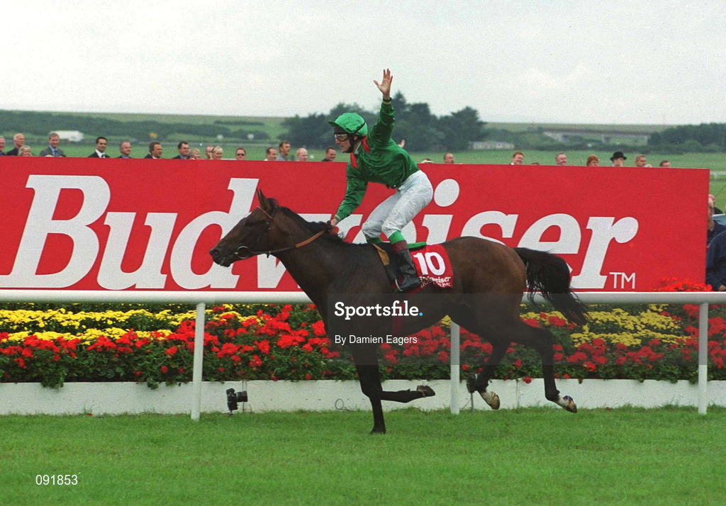 1 July 2000; Jockey Johnny Murtagh celebrates aboard Sinndar as he crosses the line to win the Budweiser Irish Derby at The Curragh Racecourse in Kildare. Photo by Damien Eagers/Sportsfile