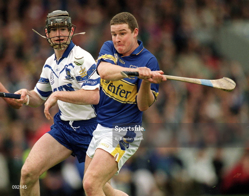 30 June 2002; John Carroll of Tipperary in action against Waterford's Tom Feeney during the Guinness Munster Senior Hurling Championship Final match between Waterford and Tipperary at Páirc Uí Chaoimh in Cork. Photo by Brendan Moran/Sportsfile