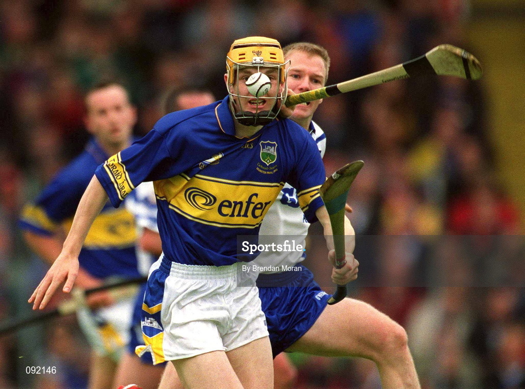 30 June 2002; Lar Corbett of Tipperary in action against Waterford's Brian Flannery during the Guinness Munster Senior Hurling Championship Final match between Waterford and Tipperary at Páirc Uí Chaoimh in Cork. Photo by Brendan Moran/Sportsfile